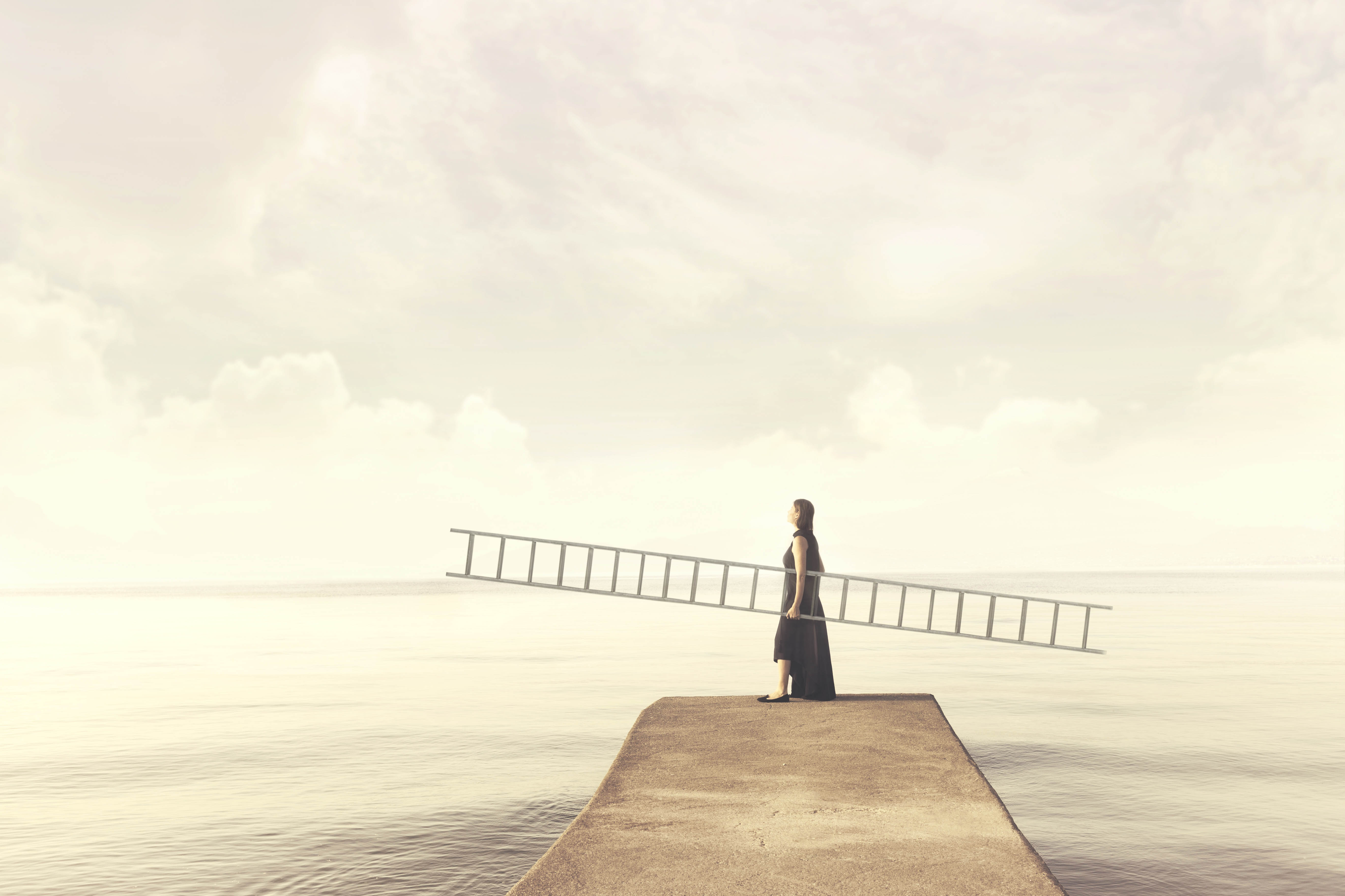 Woman holding a long ladder, staring up into the sky Woman holding a long ladder, staring up into the sky